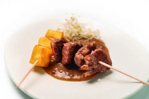 Ploma ibèrica de gla amb la nostra salsa de pernil